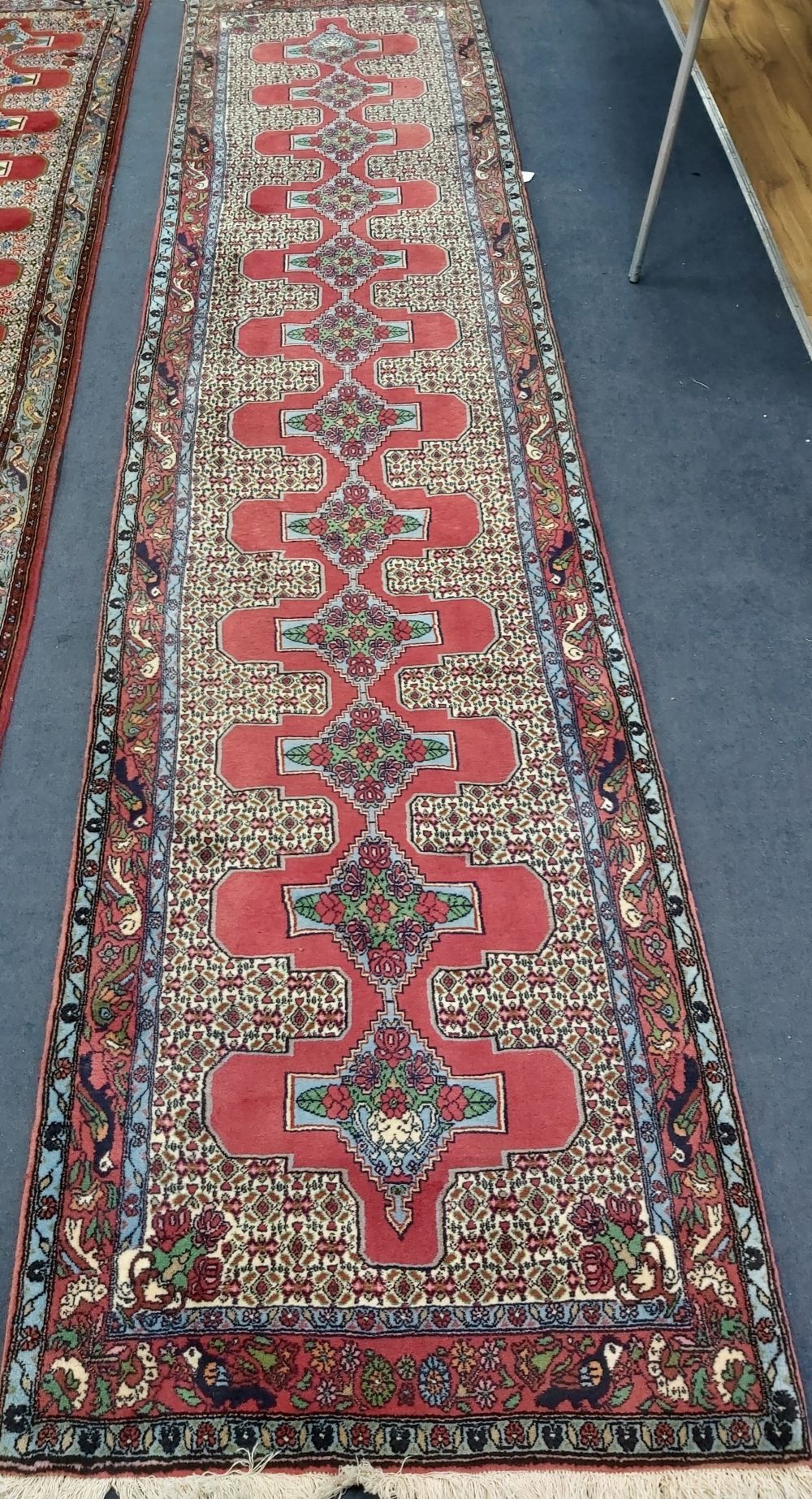 A North West Persian red ground runner, 390 x 90cm